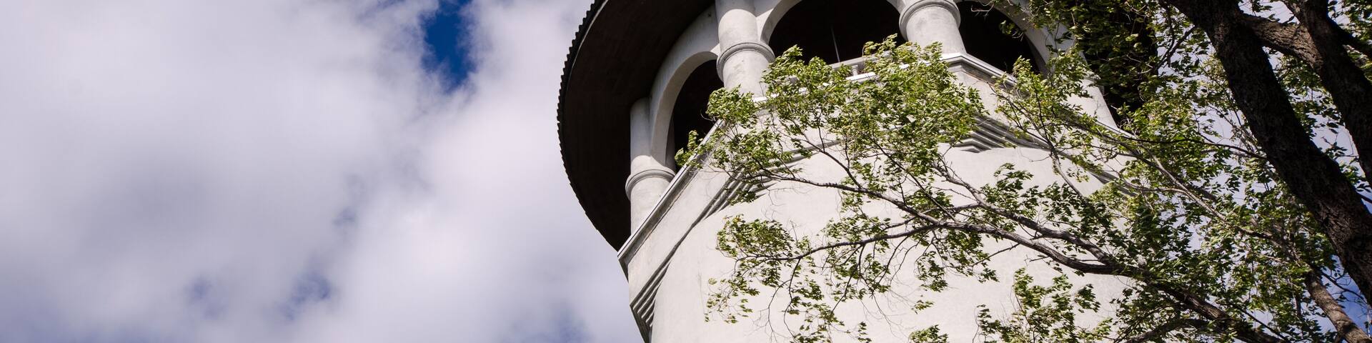 Witches Hat Water Tower in Prospect Park, Minneapolis Minnesota, on a partly cloudy day