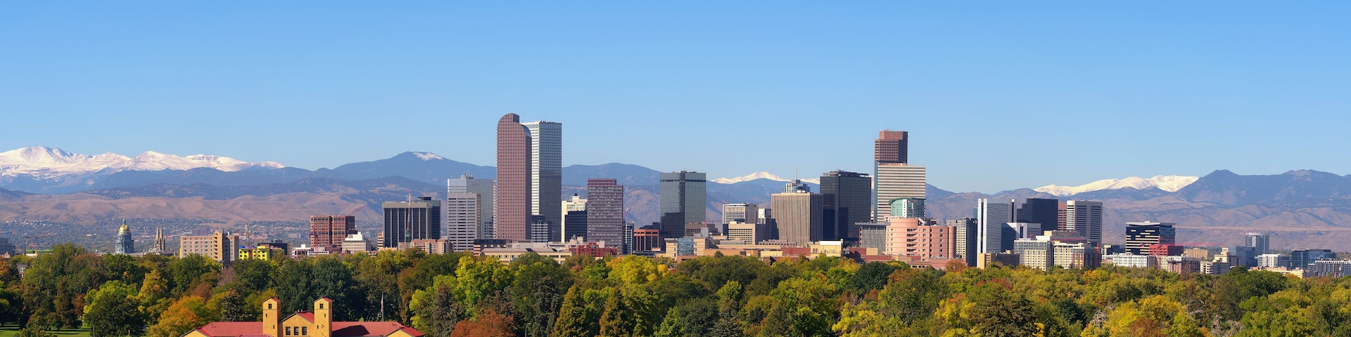 Skyline of Denver downtown with Rocky Mountains