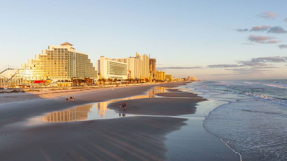 Daytona Beach, Florida, United States - October 31, 2018: Panoramic view of a beautiful sandy beach during a vibrant sunrise.