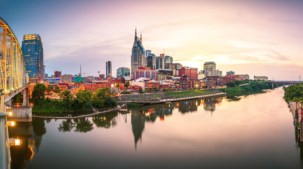 Nashville, Tennessee, USA downtown city skyline at dusk on the Cumberland River.