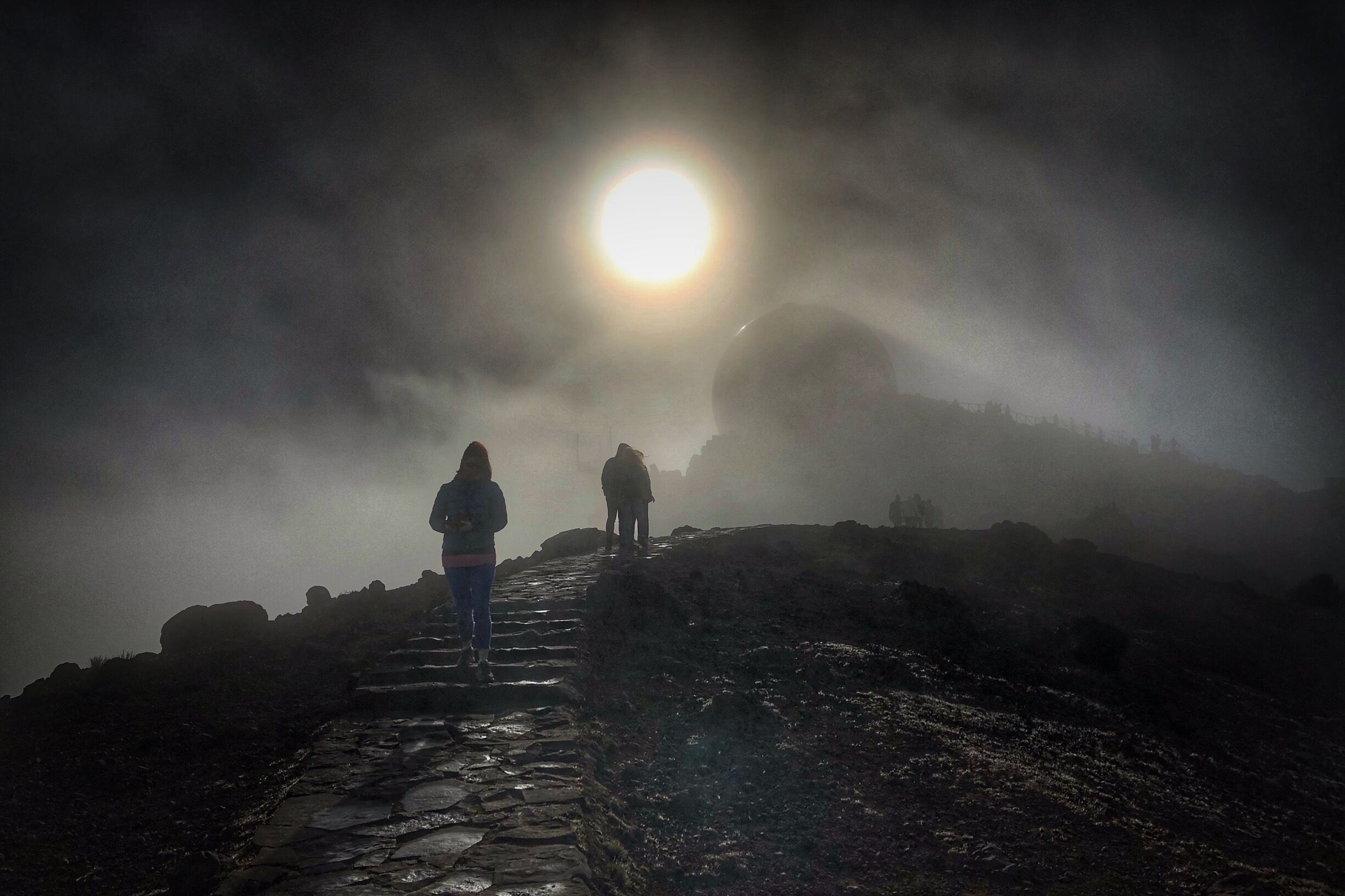 At the summit, the morning sun trying to burn the cloud cover away. 