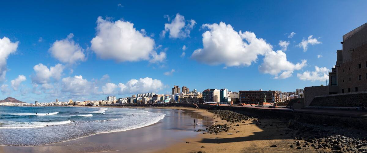 Playa de las Canteras with beautiful clouds and waves panorama