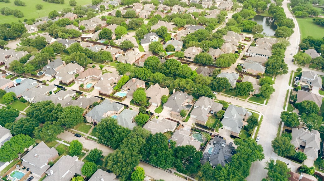 Lakeside mansion homes with solar panel roof, modern inground pools in upscale suburban neighborhood green space near Steeplechase Park and Balcones Drive in Plano, Texas, suburbs Dallas, aerial