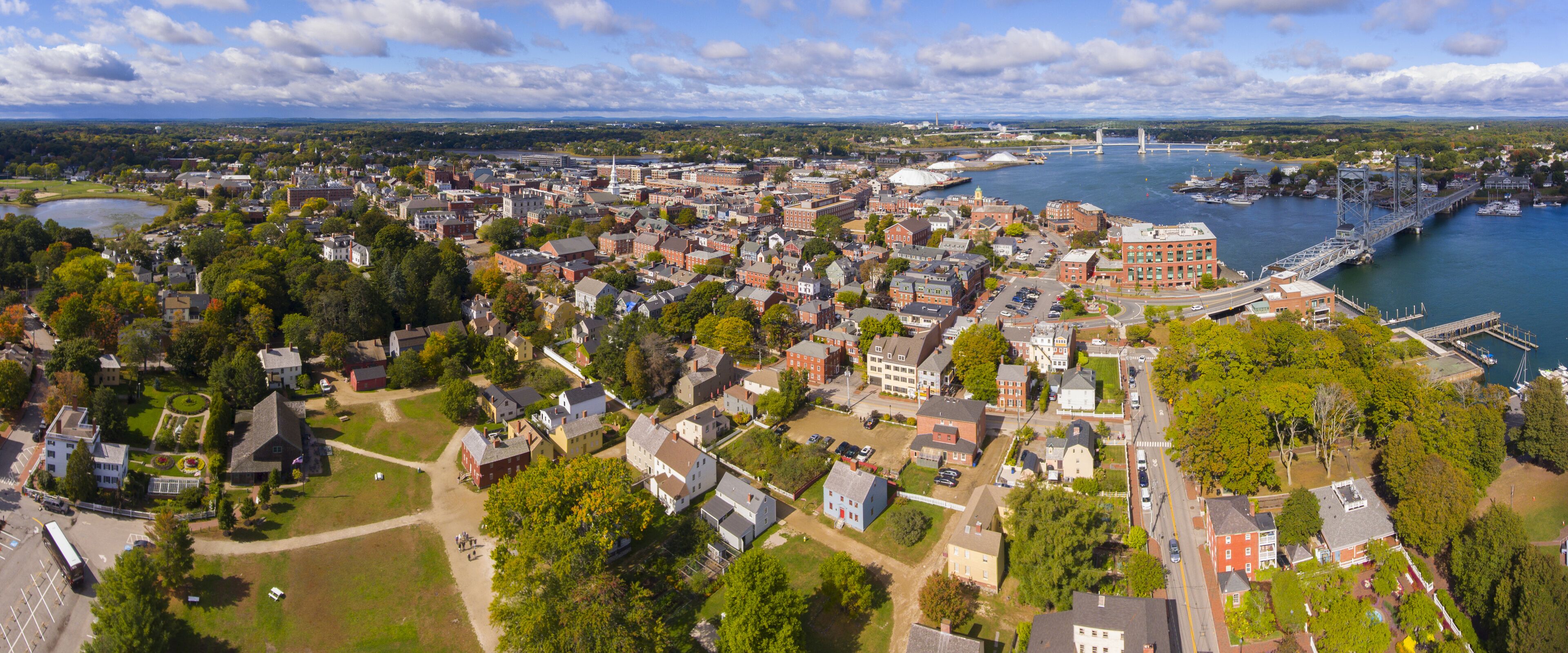 Portsmouth historic city center and Waterfront of Piscataqua River with Memorial Bridge panorama aerial view, New Hampshire, NH, USA.