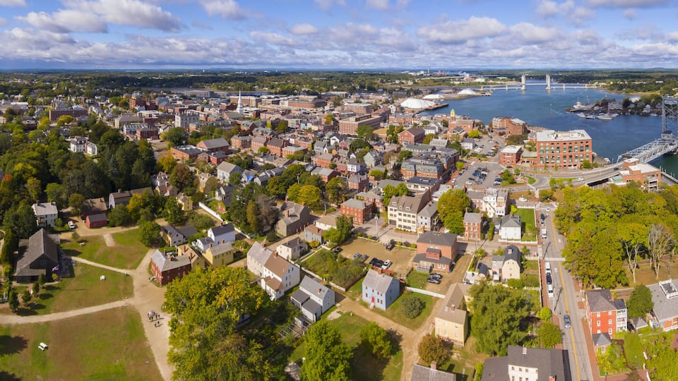 Portsmouth historic city center and Waterfront of Piscataqua River with Memorial Bridge panorama aerial view, New Hampshire, NH, USA.