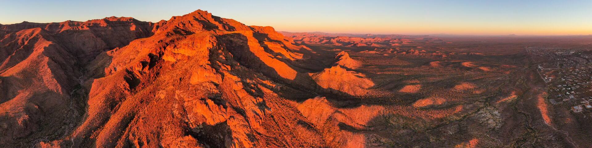 A rugged mountain range with a clear sky.