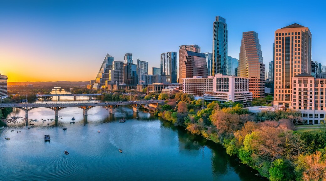 Austin, Texas- Panoramic cityscape and Colorado River against the sunset sky