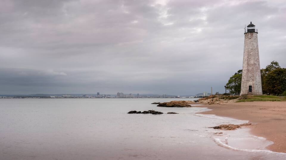 Tranquil seascape with dramatic clouds over the Lighthouse Point Park in East Haven, Connecticut