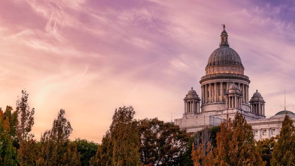 Panoramic view of Rhode Island State House. Historic Building in a modern city. Sunset Sky Art Render. Located in Downtown Providence, Rhode Island, United States.