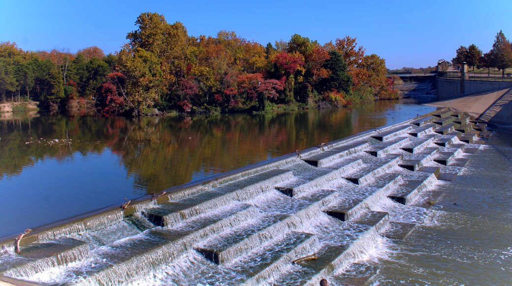 Water feature at White Rock Lake in Dallas Texas, tree lined with fall foliage.