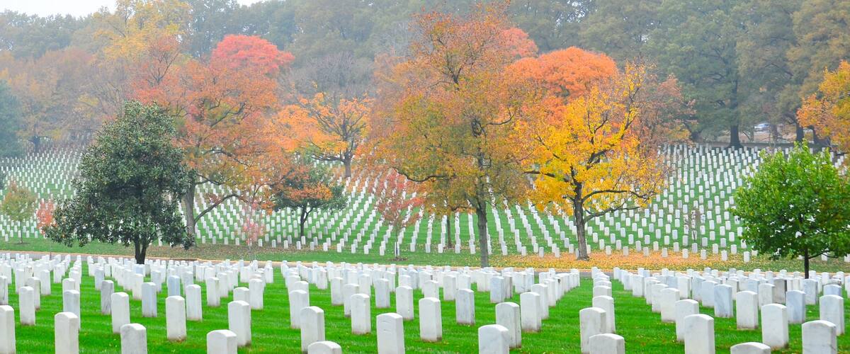 Gravestones in Arlington National Cemetery in autumn foliage - Washington D.C. United States of America