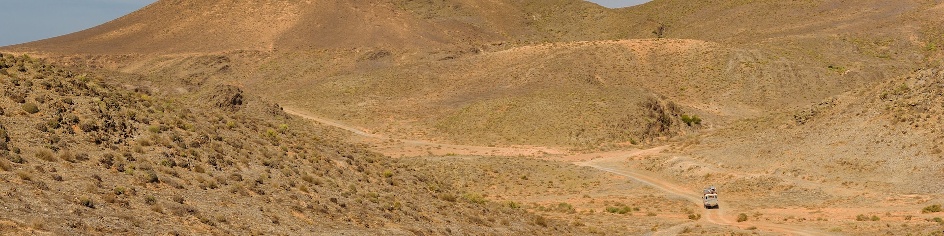 Car on a dirt road, Guelmim-Es Semara, Morocco