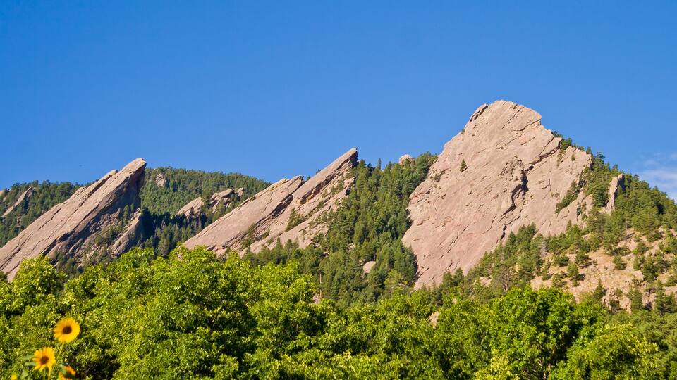 Flatirons mountains panorama from within Chautauqua Park in Boulder, Colorado in the Summertime