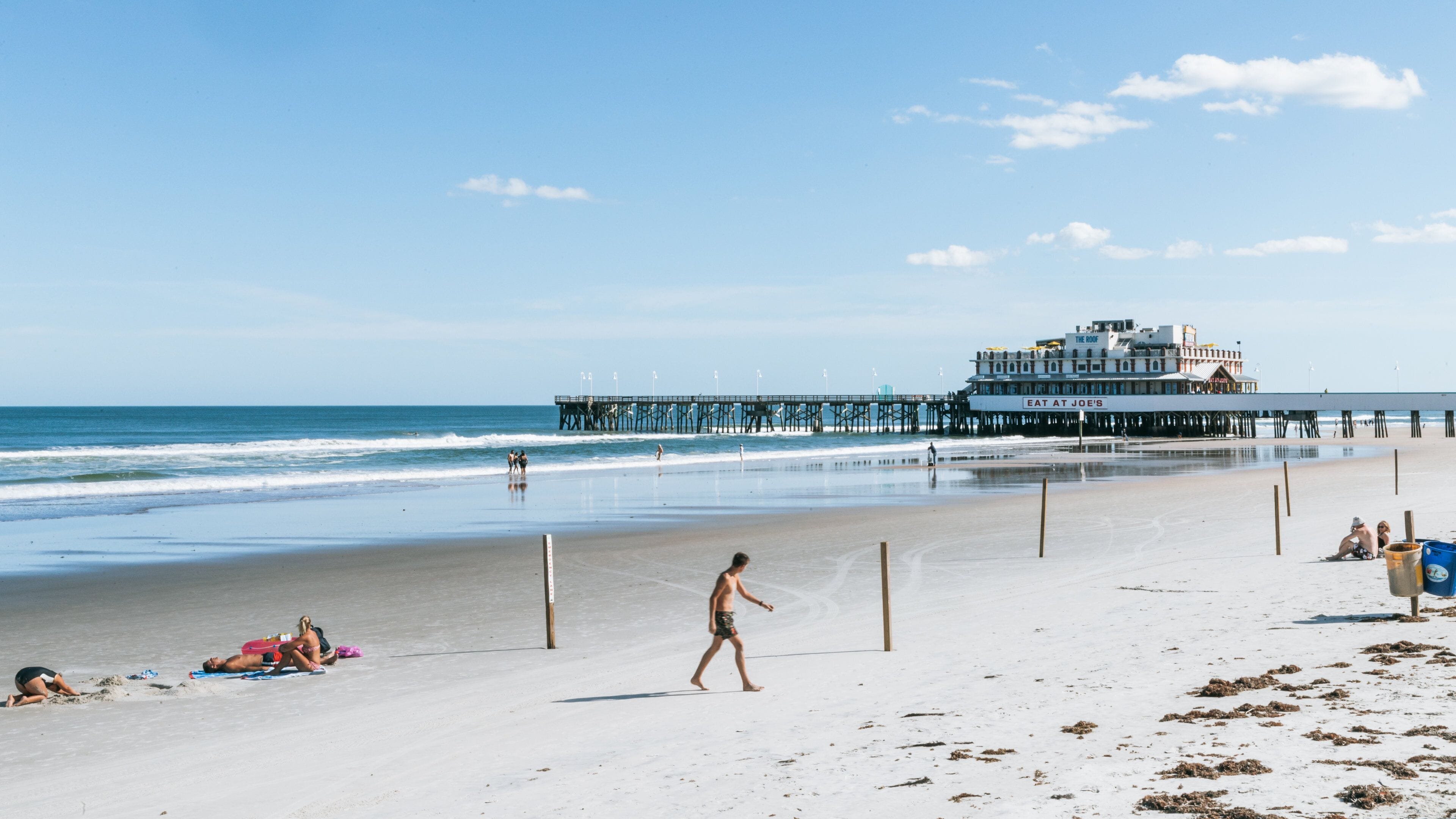Daytona Beach Pier which includes a sandy beach and general coastal views