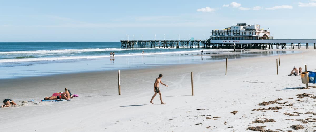 Daytona Beach Pier which includes a sandy beach and general coastal views