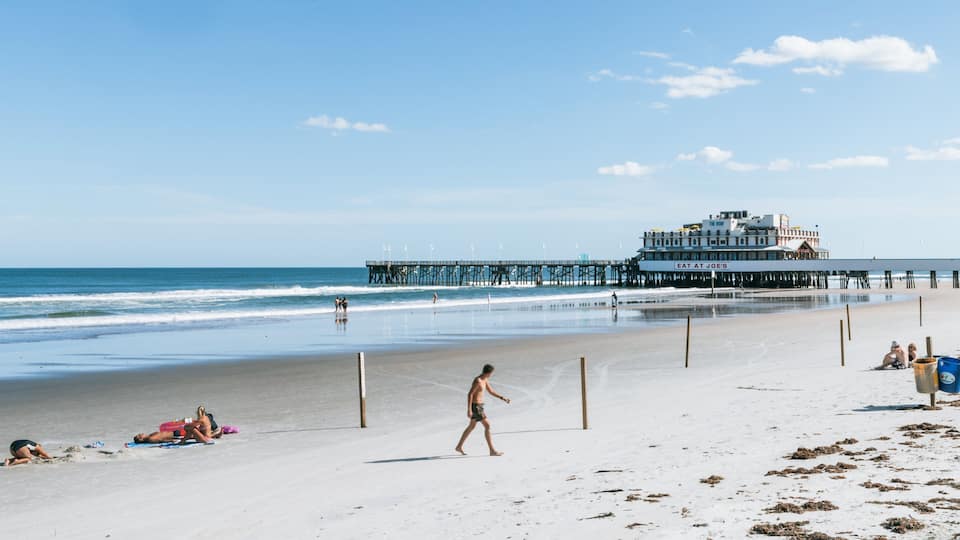 Daytona Beach Pier which includes a sandy beach and general coastal views
