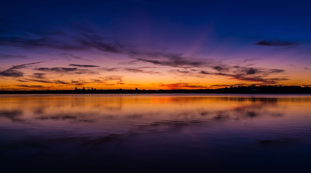 Vibrant sunset with a spectrum of colors at White Rock Lake in Dallas, Texas.