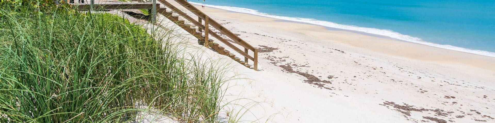 Wooden Boardwalk and Staircase Leading to Atlantic Ocean Beach Side View, Melbourne Beach, Florida, USA