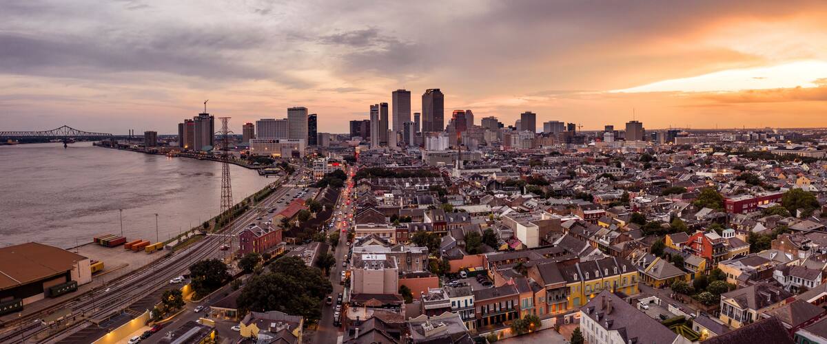 Aerial view of urban skyline with skyscrapers and Mississippi River, New Orleans city center, Marigny, Louisiana, United States.