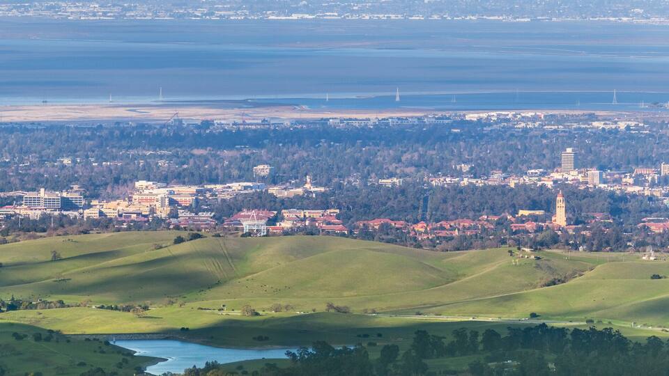 Aerial view of Stanford; Palo Alto, Menlo Park, Redwood City and the San Francisco bay shoreline in the background, Silicon Valley, California