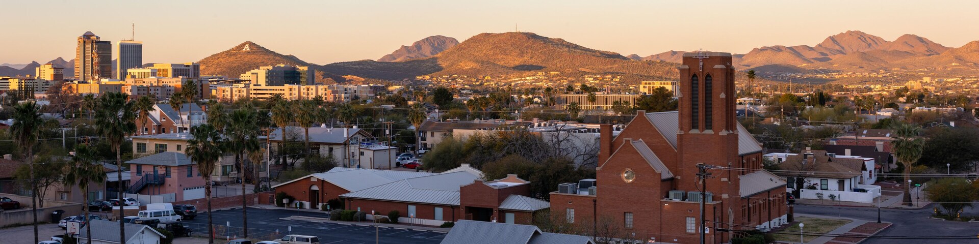 Tucson skyline at dawn with morning sun lighting the mountains