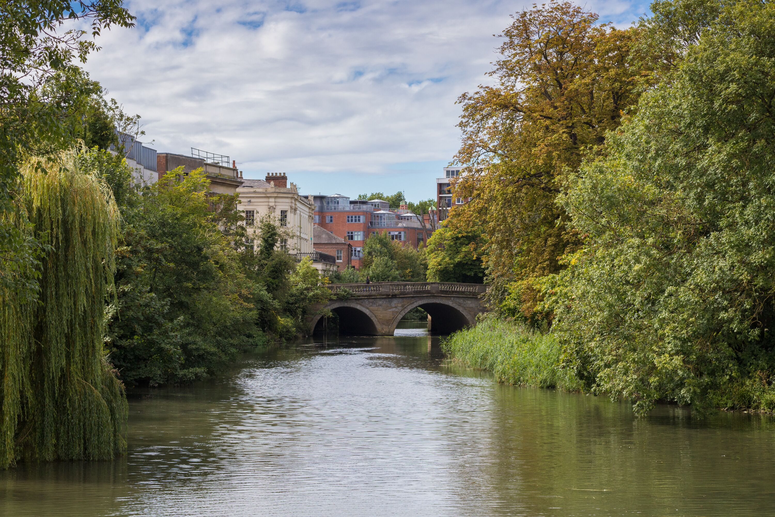 River Leam flowing through Jephson Gardens, on a beautiful Autumn day, golden tree leaves Royal Leamington Spa, Warwickshire, England, UK, September, 2017