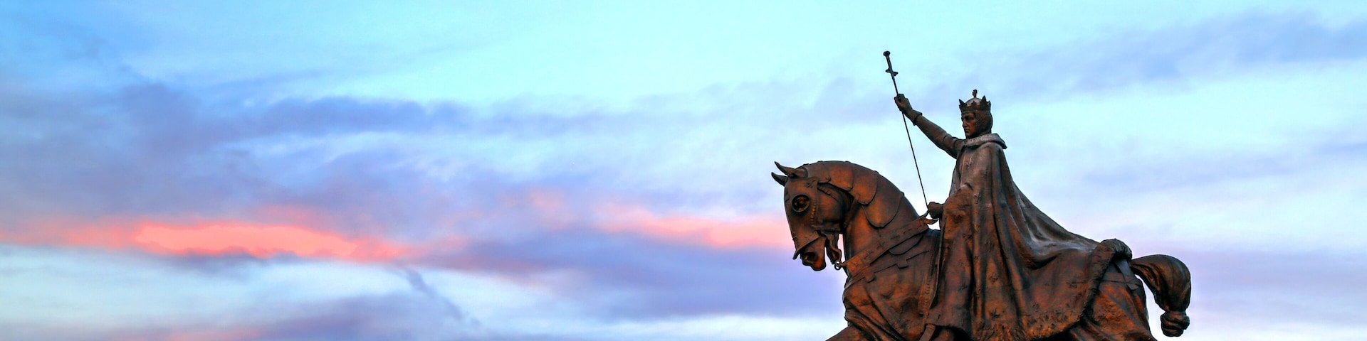 The sunset over the Apotheosis of St. Louis statue of King Louis IX of France, namesake of St. Louis, Missouri in Forest Park, St. Louis, Missouri.