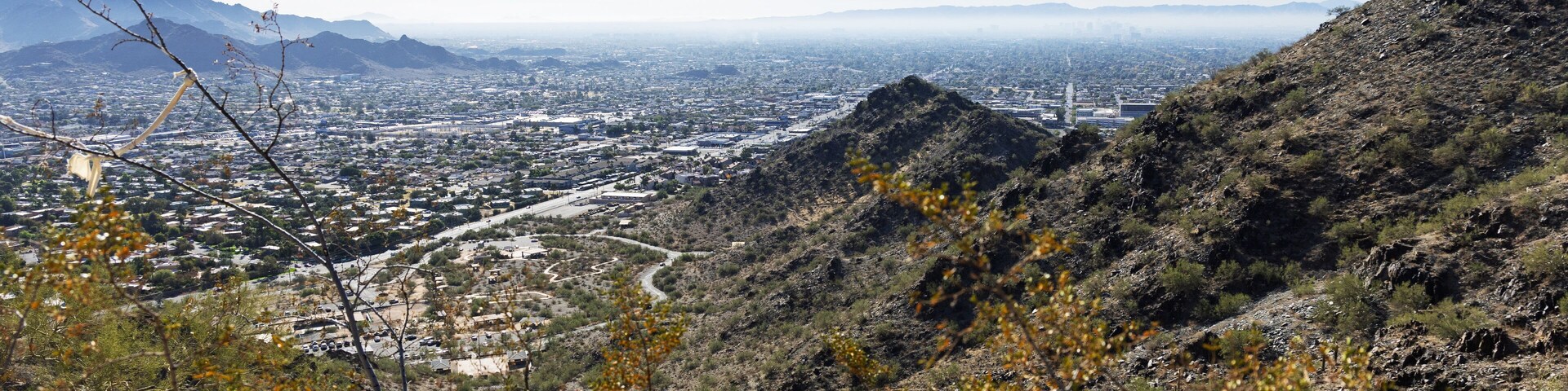 Morning haze above major Arizona city downtown of Phoenix as seen from the top of North Mountain Park hiking trails