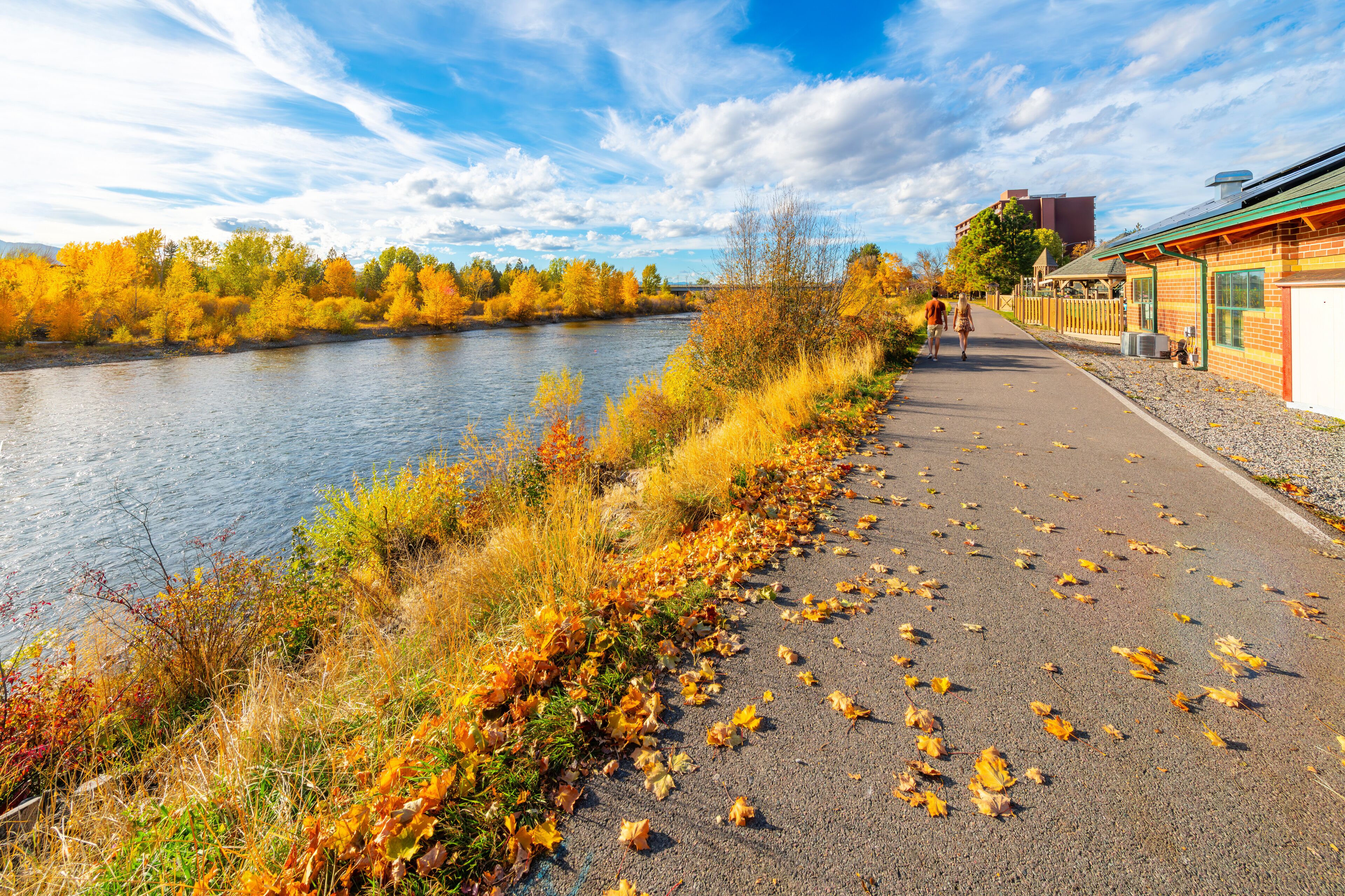 View from the Riverfront Trail walking path along the Clark Fork River at Caras Park of the University District in downtown Missoula, Montana.