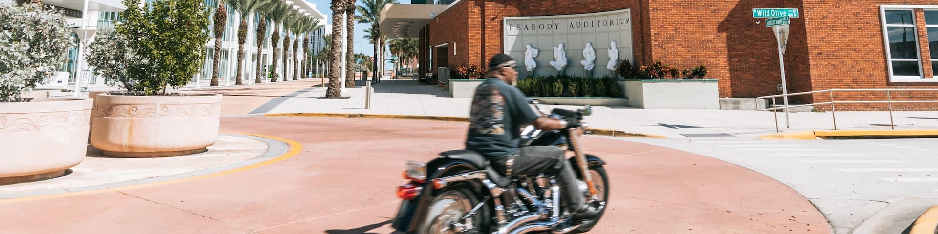 Peabody Auditorium featuring motorcycle riding as well as an individual male