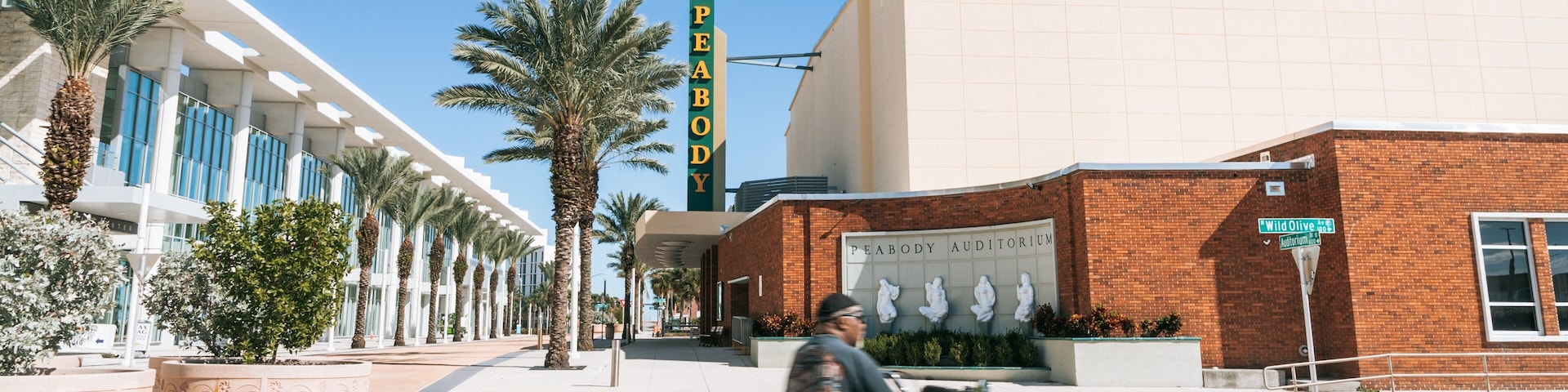 Peabody Auditorium featuring motorcycle riding as well as an individual male