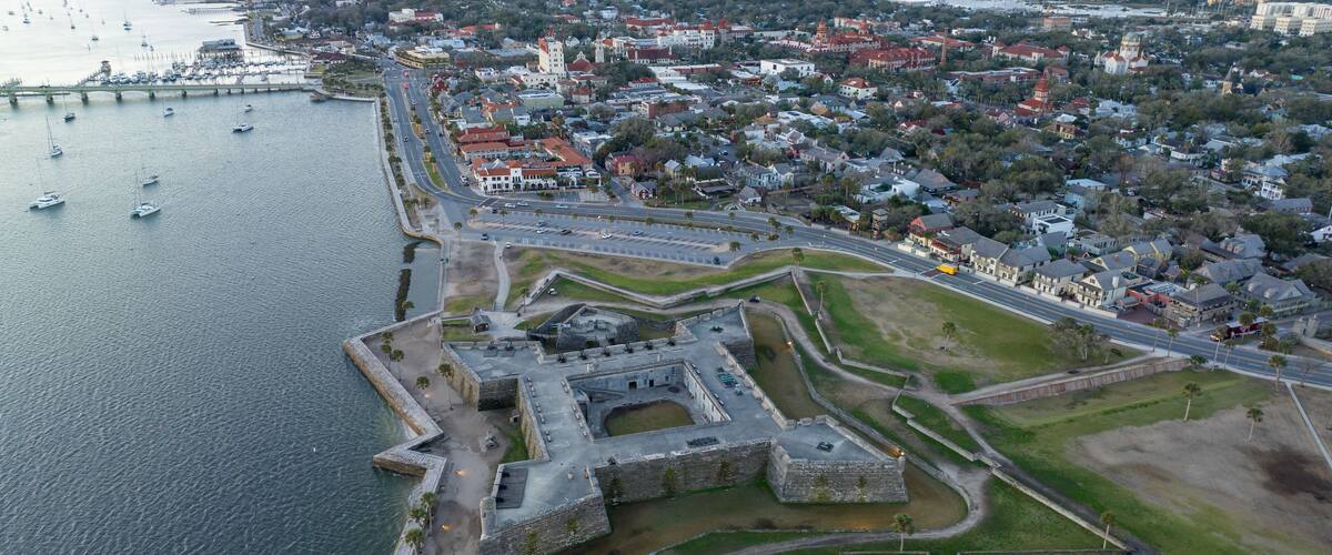 Drone shot of the Castillo de San Marcos National Monument during sunrise.
