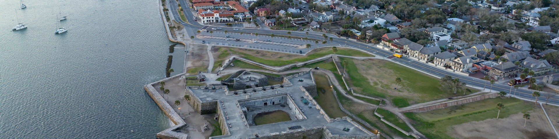 Drone shot of the Castillo de San Marcos National Monument during sunrise.