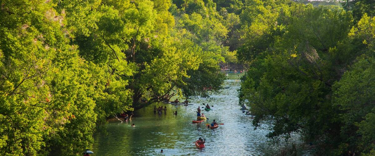 Barton Hills showing kayaking or canoeing and a river or creek as well as a small group of people
