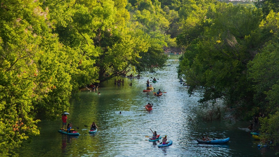 Barton Hills showing kayaking or canoeing and a river or creek as well as a small group of people
