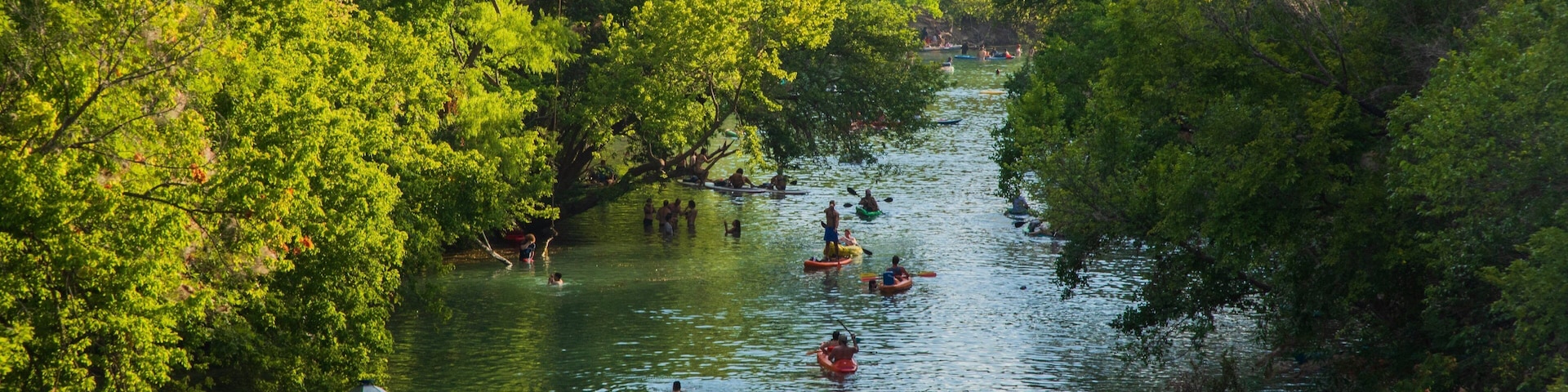 Barton Hills showing kayaking or canoeing and a river or creek as well as a small group of people