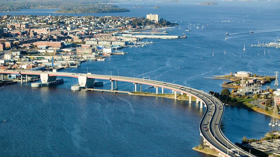 Aerial of downtown Portland, Maine showing Maine Medical Center, Commercial street, Old Port, Back Bay and the Casco Bay Bridge from South Portland