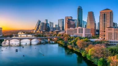 Austin, Texas- Panoramic cityscape and Colorado River against the sunset sky