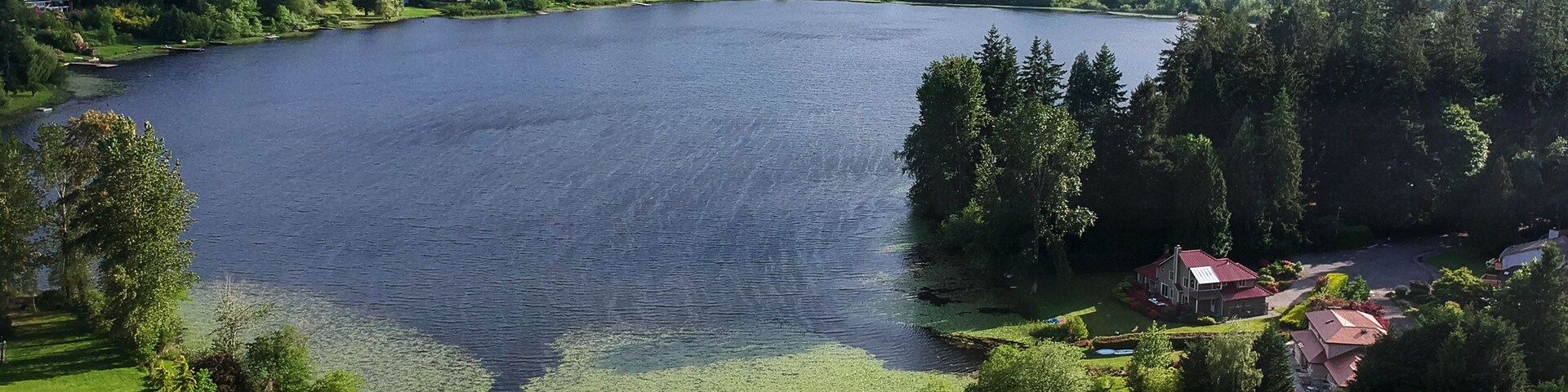 Picturesque Phantom Lake and the surrounding sprawling communities of Robinswood, Lake Hill and West Lake Sammamish in Bellevue, Washington.