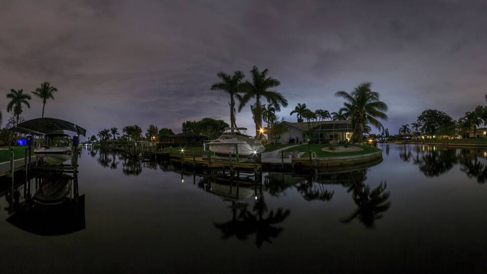 Panoramic picture of Cape Coral water channels at night in spring