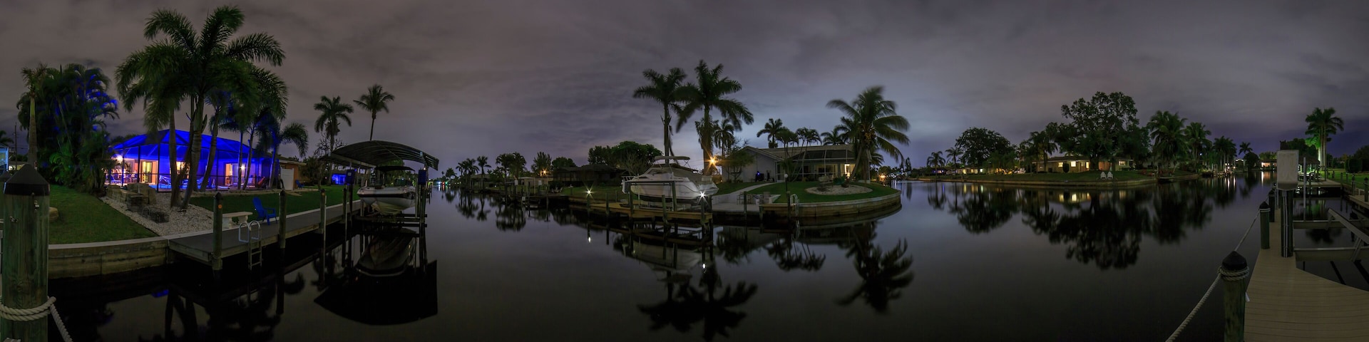 Panoramic picture of Cape Coral water channels at night in spring