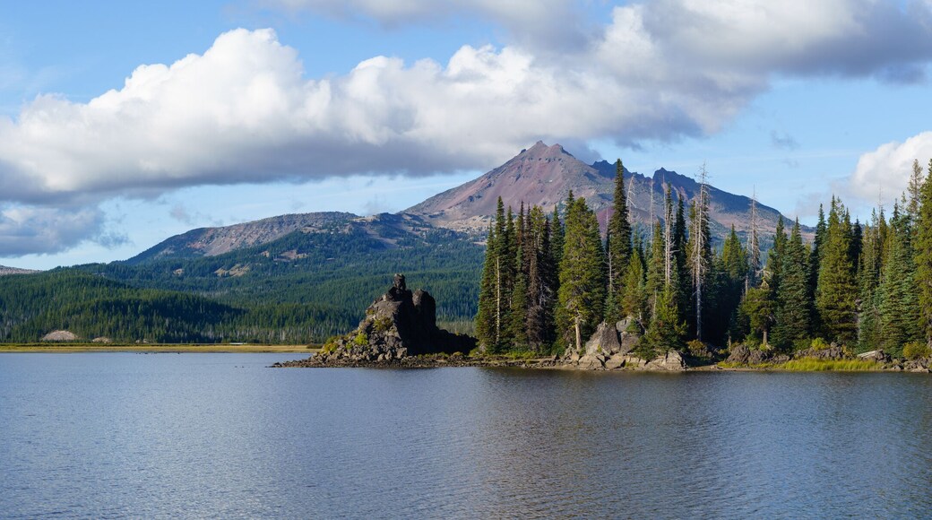 Clouds form above South Sisters and Broken Top as viewed from Sparks Lake, near Bend, Oregon.