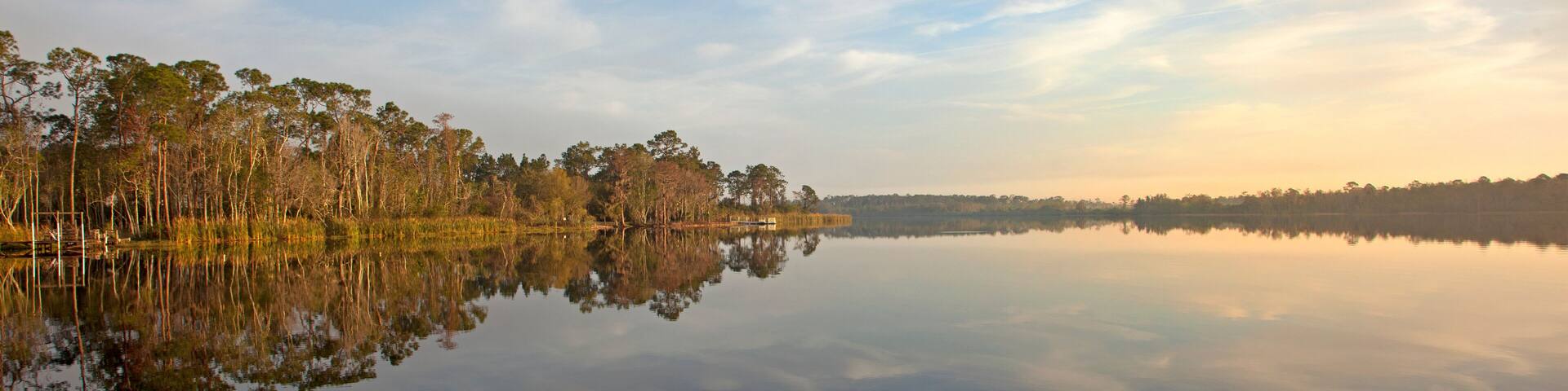 reflection over lake with sunrise