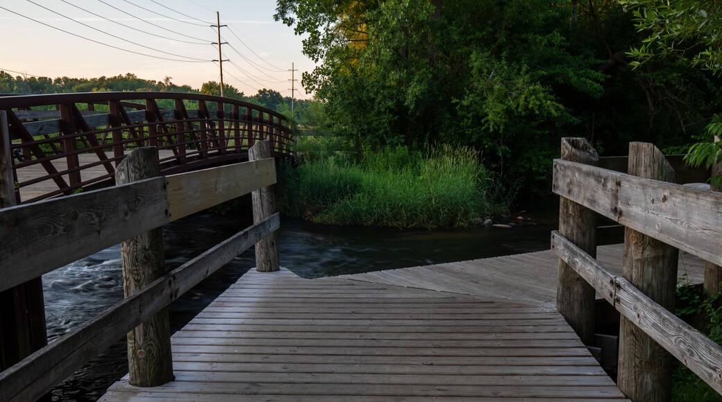 Wood deck over stream at portage creek bicentennial park in Michigan