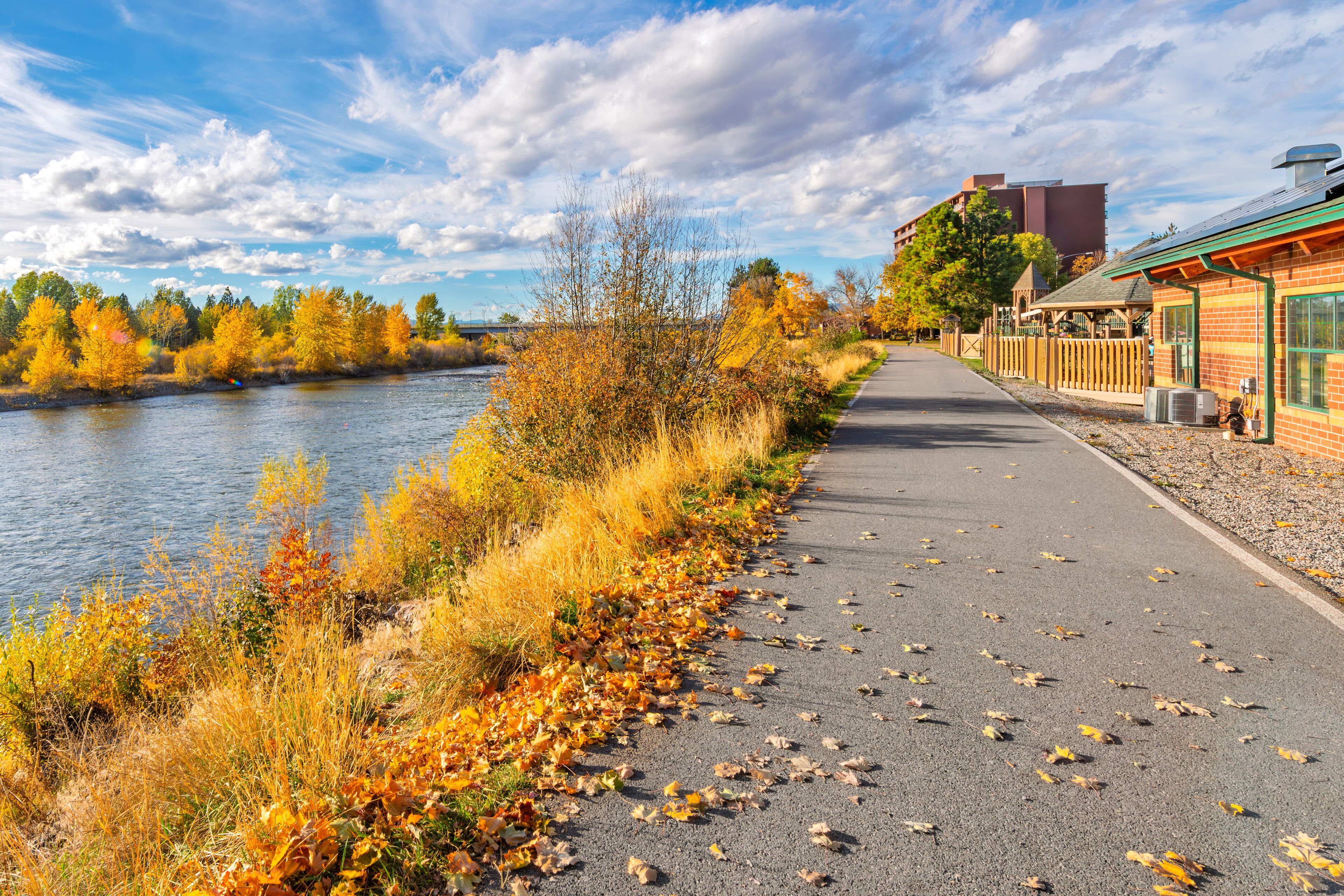View from the Riverfront Trail walking path along the Clark Fork River at Caras Park of the University District in downtown Missoula, Montana.	