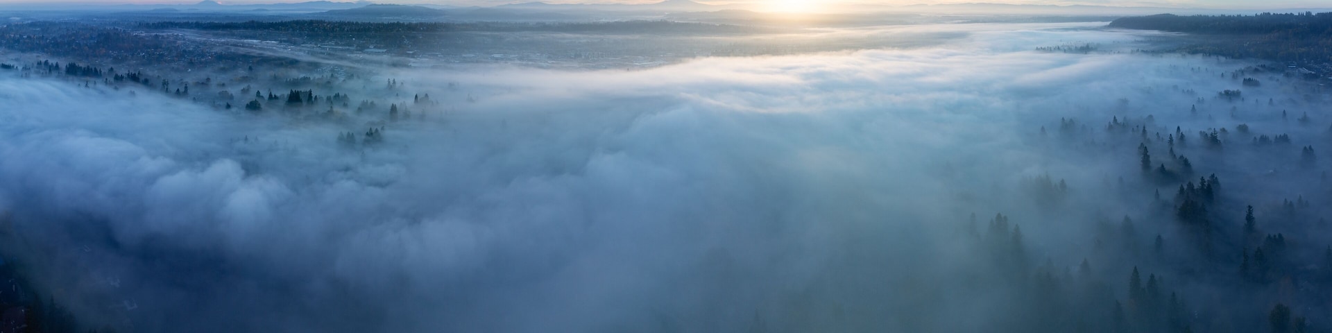 Early morning fog drifts through the Willamette Valley in West Linn, Oregon. This scenic area lies just south of the Pacific Northwest city of Portland.