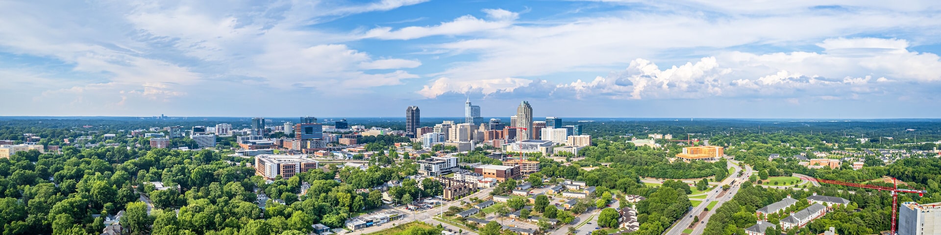View of downtown Raleigh, North Carolina with blue sky background.