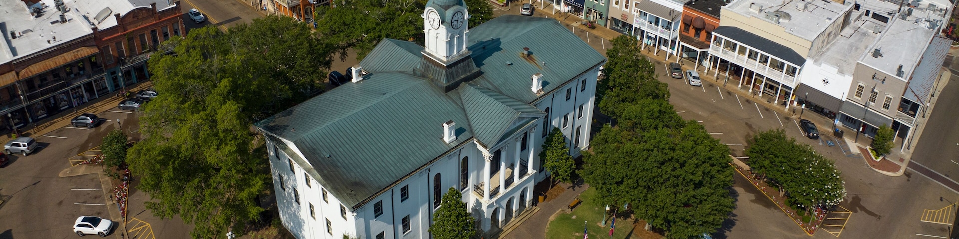 JULY 8, 2023, OXFORD, MS., USA - town courthouse and surrounding stores in historic ole' Miss hometown of University and symbol of south