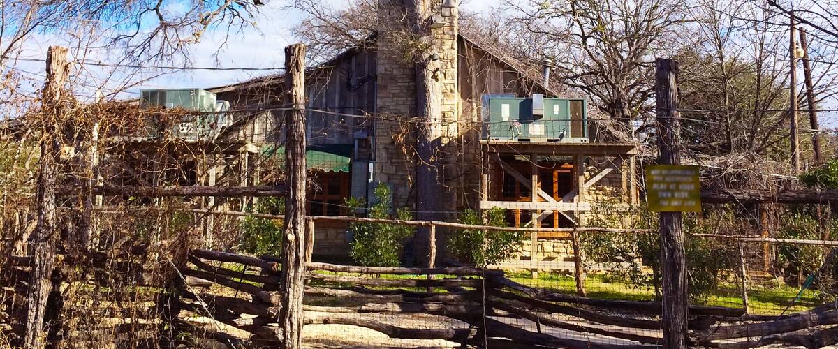 Shack or farmhouse. Old house in Texas. Old trees surrounding it.