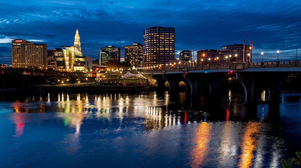 10/19/22 - HARTFORD CT., USA - skyline view of Hartford CT on Connecticut River with lights coming on